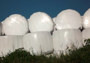 a stack of wrapped round bales
